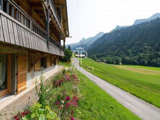Discover a charming property nestled in a picturesque mountain setting.