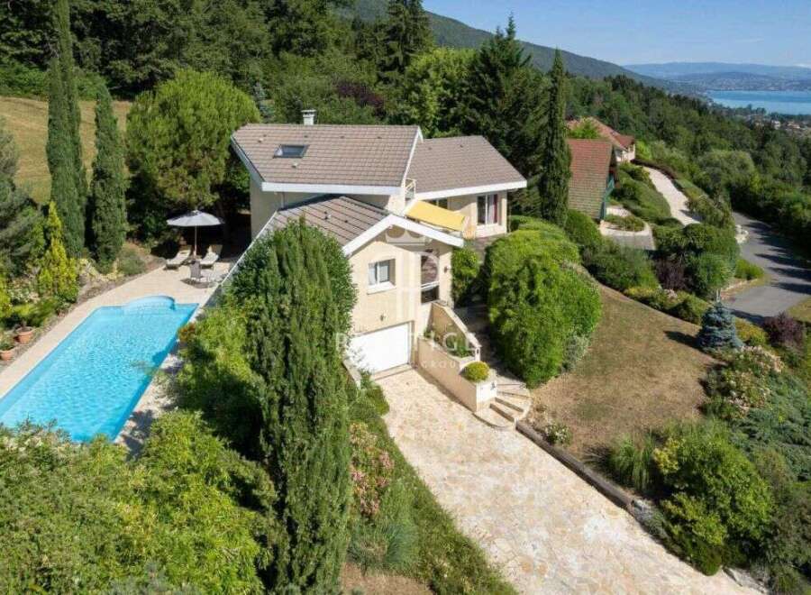 Discover a stunning property nestled in a picturesque landscape, boasting a private swimming pool and lush greenery.