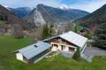 Discover a stunning property nestled in a picturesque mountain setting.