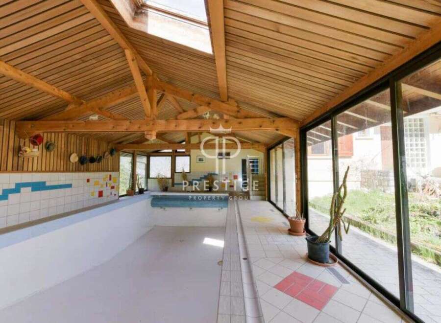 Discover luxury living with this stunning property featuring an indoor pool.