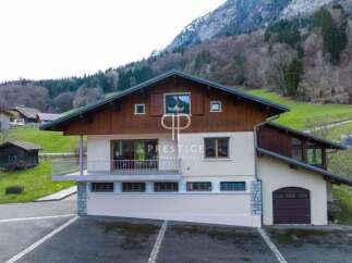 Discover a stunning property nestled in a picturesque mountain setting.