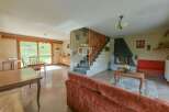 Discover a charming property featuring a cozy living space with a fireplace, perfect for relaxing evenings.