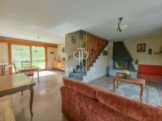 Discover a charming property featuring a cozy living space with a fireplace, perfect for relaxing evenings.