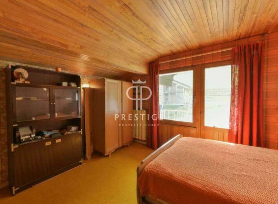 Discover a charming bedroom with a warm, inviting ambiance.