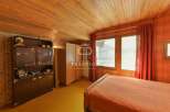 Discover a charming bedroom with a warm, inviting ambiance.