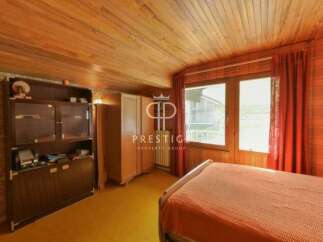 Discover a charming bedroom with a warm, inviting ambiance.