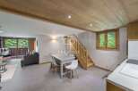 Discover a charming property featuring a cozy living space with a modern dining area.