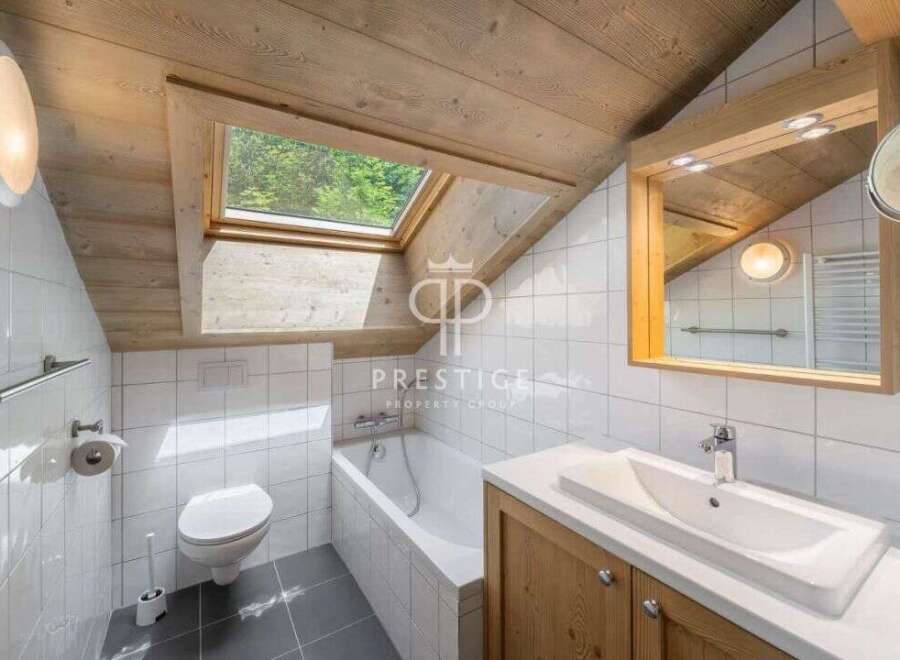 Discover the charm of this unique bathroom, featuring a skylight that floods the space with natural light.