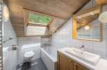 Discover the charm of this unique bathroom, featuring a skylight that floods the space with natural light.