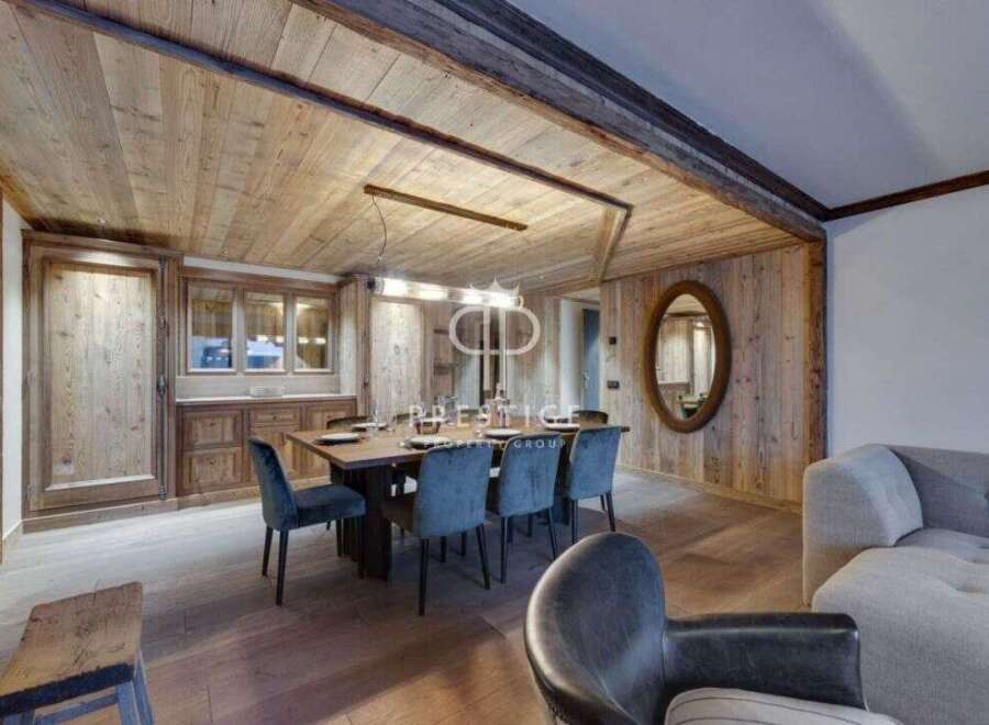 Experience rustic elegance in this stunning property, featuring exquisite wooden paneling and a warm, inviting atmosphere.