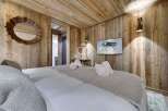 Experience rustic luxury in this stunning bedroom.