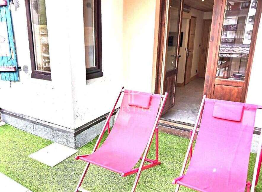 Enjoy the tranquility of this charming property, featuring a cozy outdoor space perfect for relaxation.