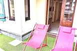 Enjoy the tranquility of this charming property, featuring a cozy outdoor space perfect for relaxation.