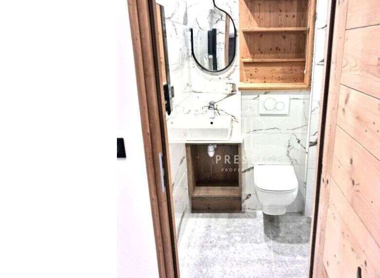 Discover a stylish bathroom with modern fixtures and a sleek design.