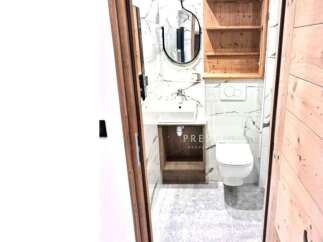 Discover a stylish bathroom with modern fixtures and a sleek design.
