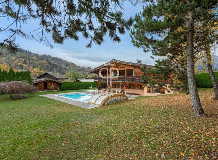 Discover a luxurious chalet nestled in a picturesque mountain setting.