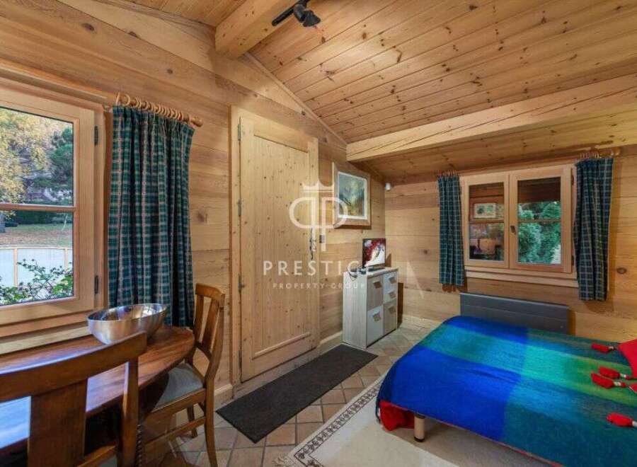 Discover the charm of this cozy cabin retreat, featuring warm wooden interiors and a welcoming atmosphere.