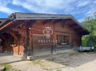 Discover the charm of this stunning wooden property, showcasing exquisite craftsmanship and a warm, inviting atmosphere.