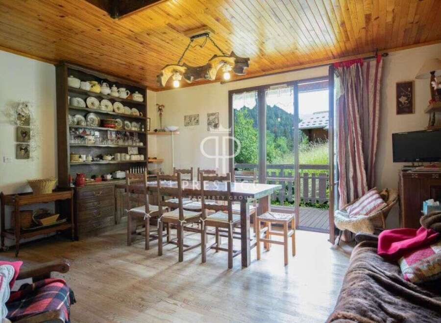 This charming property boasts a rustic interior with wooden accents, creating a warm and inviting atmosphere.