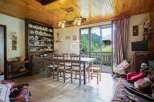 This charming property boasts a rustic interior with wooden accents, creating a warm and inviting atmosphere.
