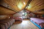 Discover a charming attic bedroom with a cozy atmosphere.