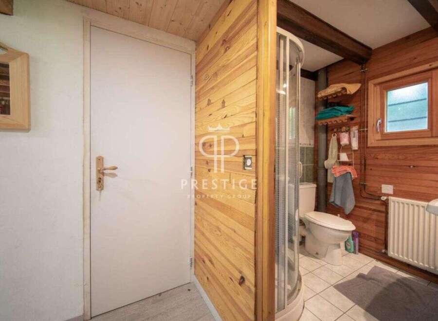 Discover a charming bathroom with a unique wooden design.