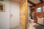 Discover a charming bathroom with a unique wooden design.