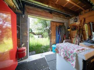 Explore this charming property with a unique storage space.