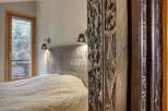 Discover the elegance of this property, featuring a beautifully carved wooden pillar that adds a touch of artistry to the space.