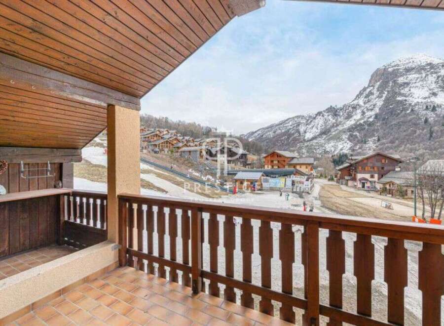 Enjoy breathtaking mountain views from this charming balcony.