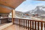 Enjoy breathtaking mountain views from this charming balcony.