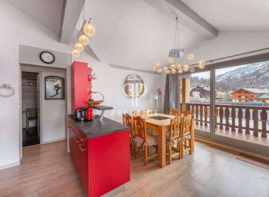 Discover a charming kitchen with a vibrant red design, perfect for culinary adventures.