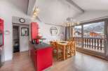 Discover a charming kitchen with a vibrant red design, perfect for culinary adventures.