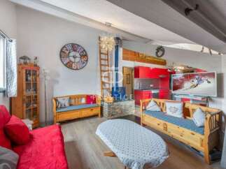 Discover a cozy living space with a unique blend of rustic charm and modern amenities.