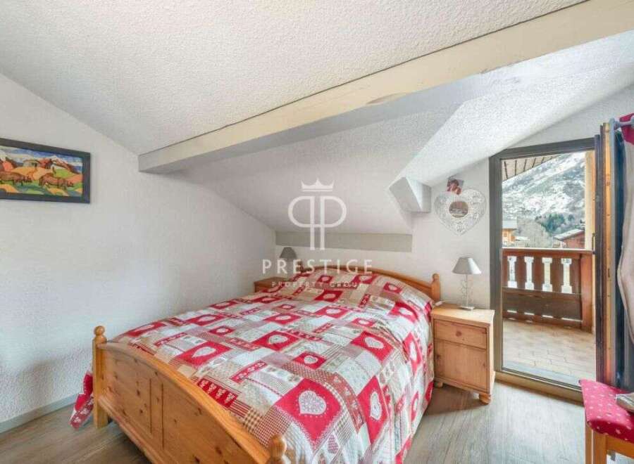 Cozy bedroom with a stunning mountain view.