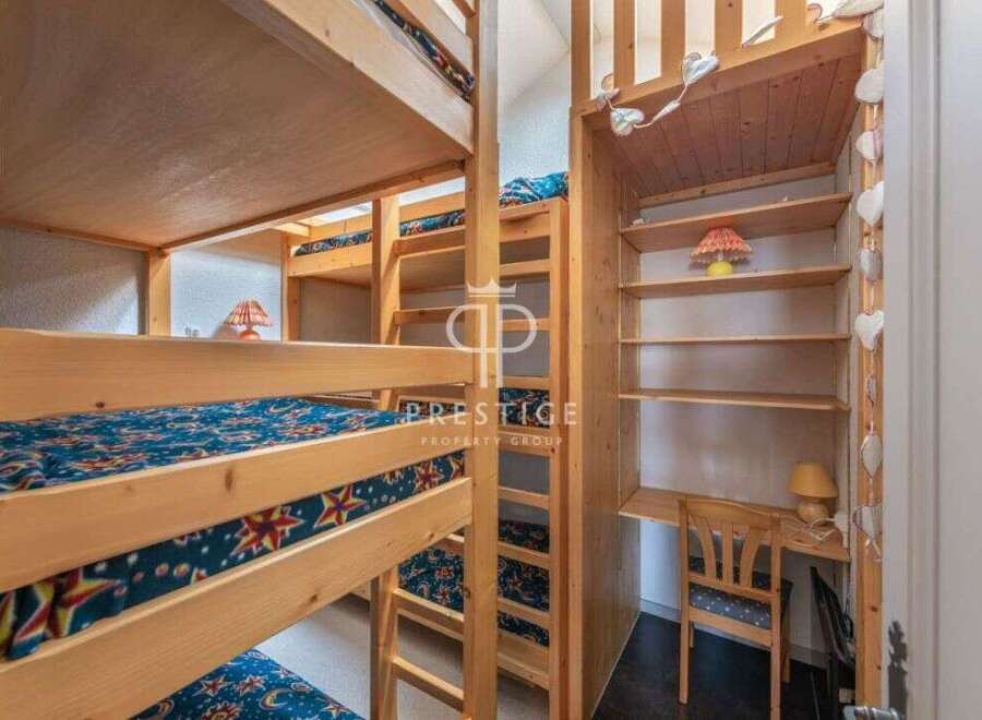 Discover a unique property featuring custom-built bunk beds, perfect for accommodating guests or family.