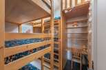 Discover a unique property featuring custom-built bunk beds, perfect for accommodating guests or family.