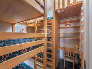 Discover a unique property featuring custom-built bunk beds, perfect for accommodating guests or family.
