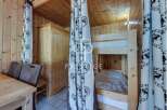 Cozy cabin retreat featuring a charming bunk bed setup, perfect for family getaways.