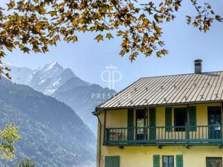 Discover a stunning property nestled amidst breathtaking mountain views.