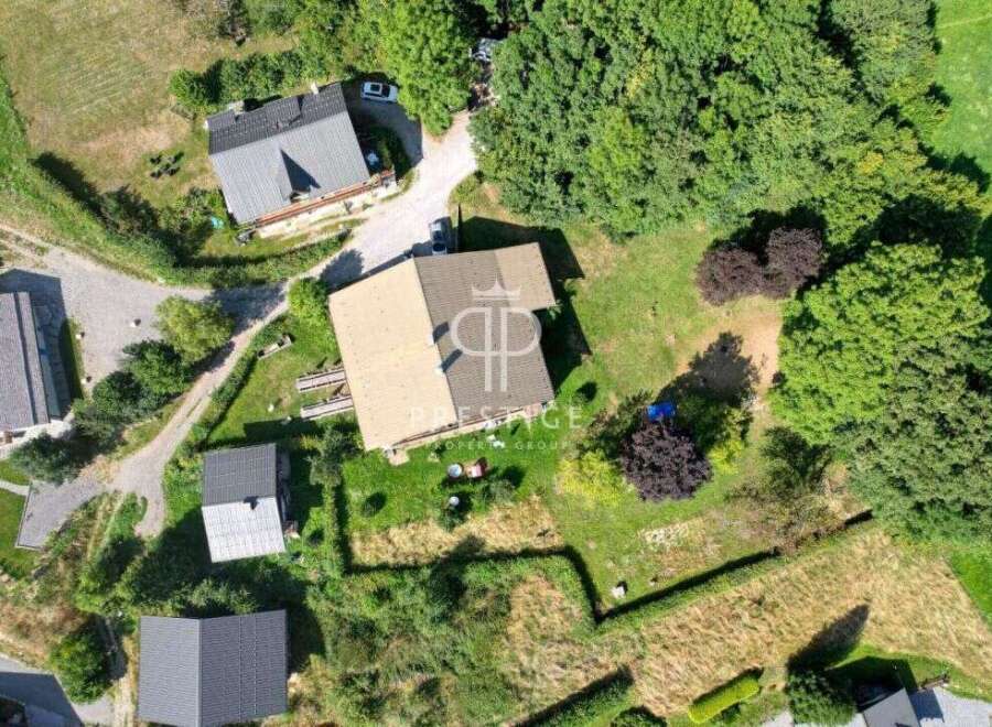 Discover a stunning property nestled in a serene, green environment.