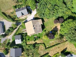 Discover a stunning property nestled in a serene, green environment.