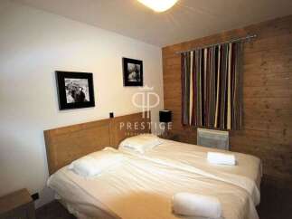 Cozy bedroom featuring a comfortable bed, perfect for a relaxing stay.