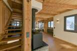 Discover the charm of this stunning property, featuring a beautifully crafted wooden staircase and a cozy fireplace.