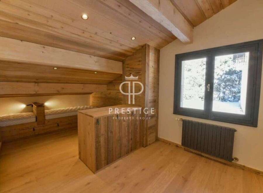 Discover the charm of this stunning property, featuring a cozy wooden interior and a unique design.