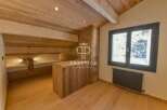 Discover the charm of this stunning property, featuring a cozy wooden interior and a unique design.