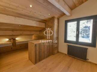 Discover the charm of this stunning property, featuring a cozy wooden interior and a unique design.