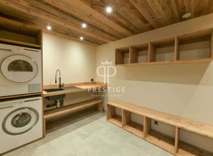 Discover a modern laundry room with a sleek design.