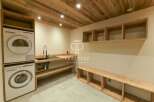Discover a modern laundry room with a sleek design.