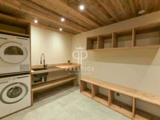 Discover a modern laundry room with a sleek design.